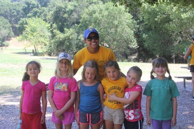 Camper group and Counselor smiling together at Lafayette Reservoir Camper group and Counselor smiling together at Lafayette Reservoir